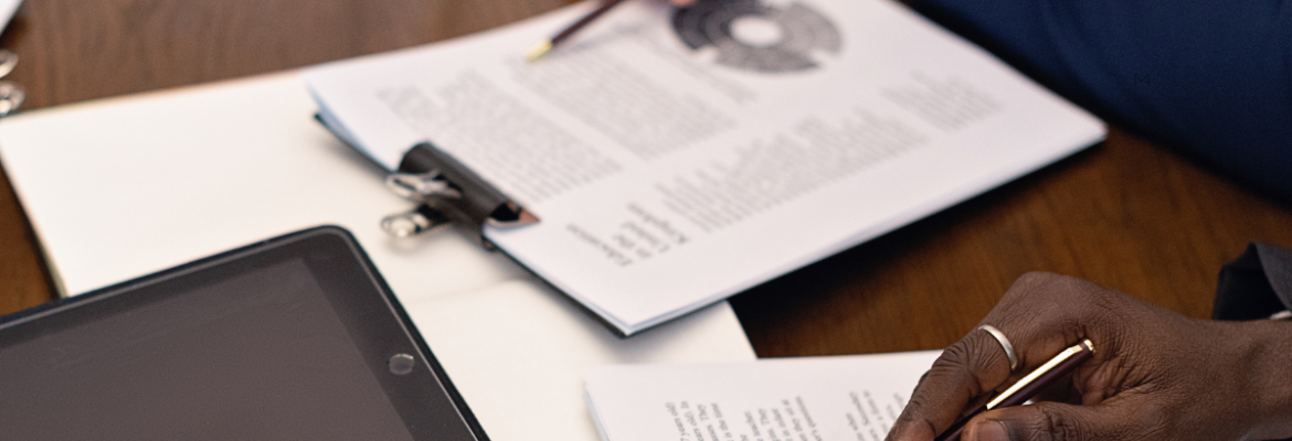 Close-up of hands reviewing office documents