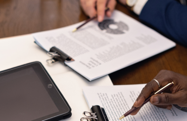 Close-up of hands reviewing office documents