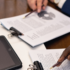 Close-up of hands reviewing office documents