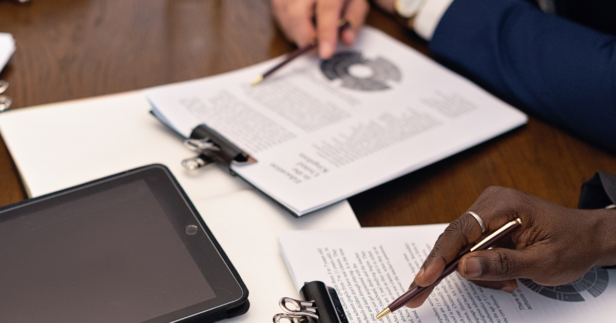 Close-up of hands reviewing office documents